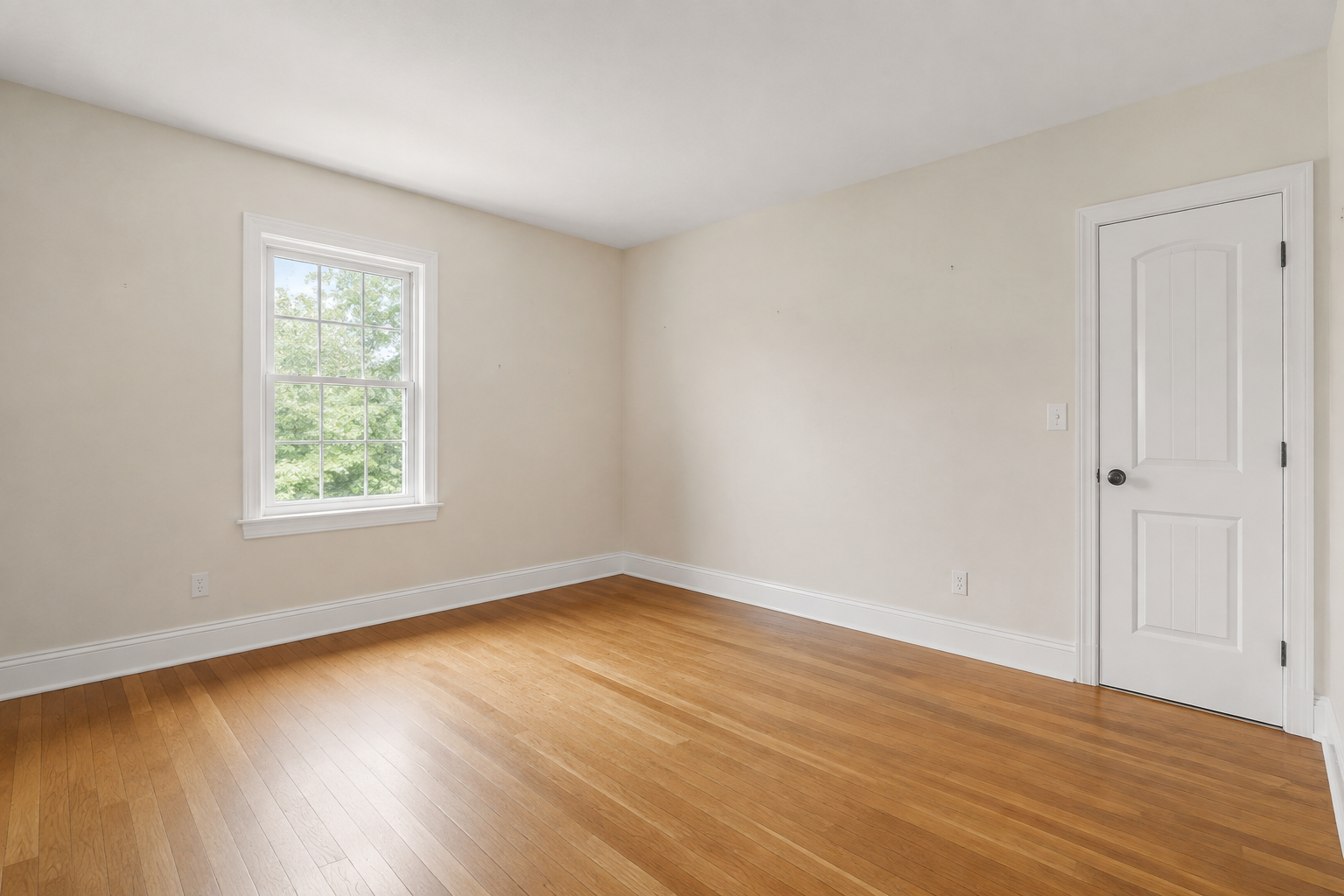Illustrative interior room with a window, door, smooth ceiling, and baseboards